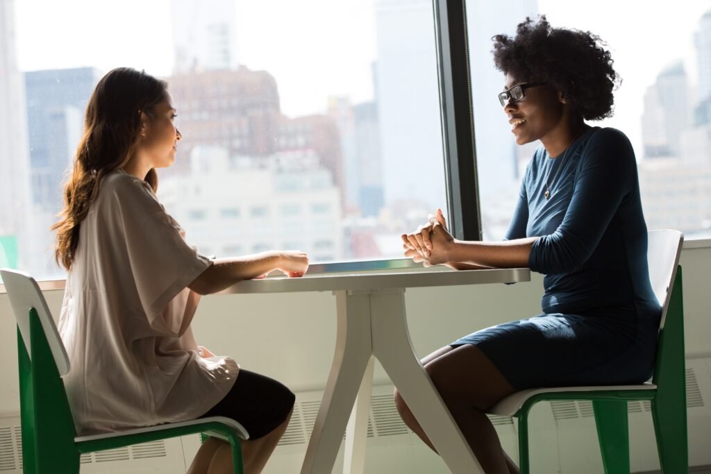 two women sitting down for job interview