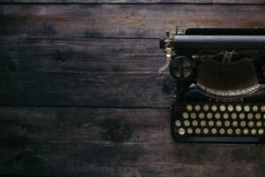 typewriter on wooden desk